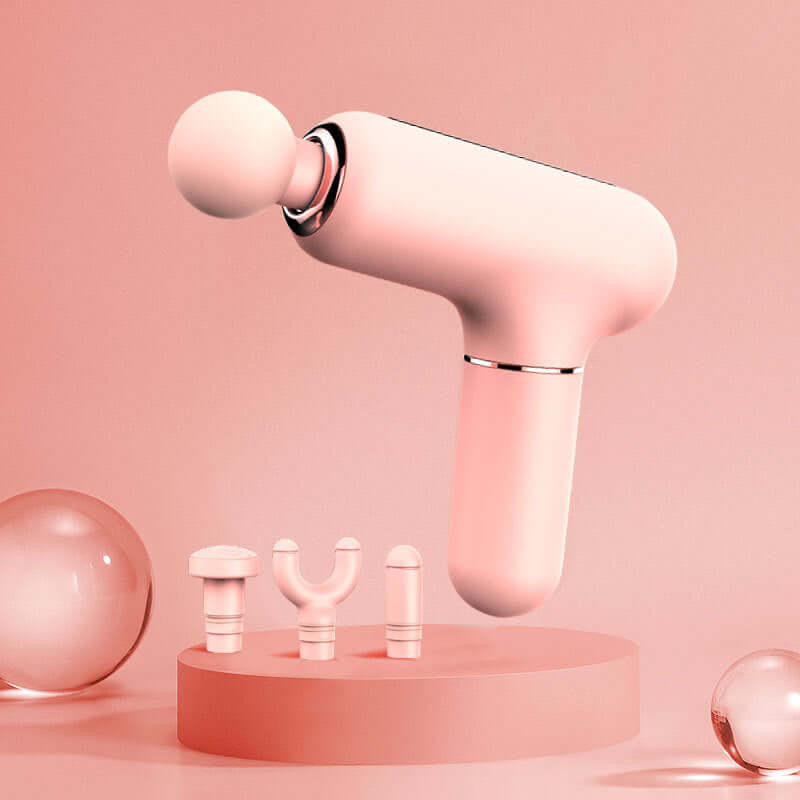 Mini USB Muscle Massage Gun Percussive with interchangeable heads on a pink display.